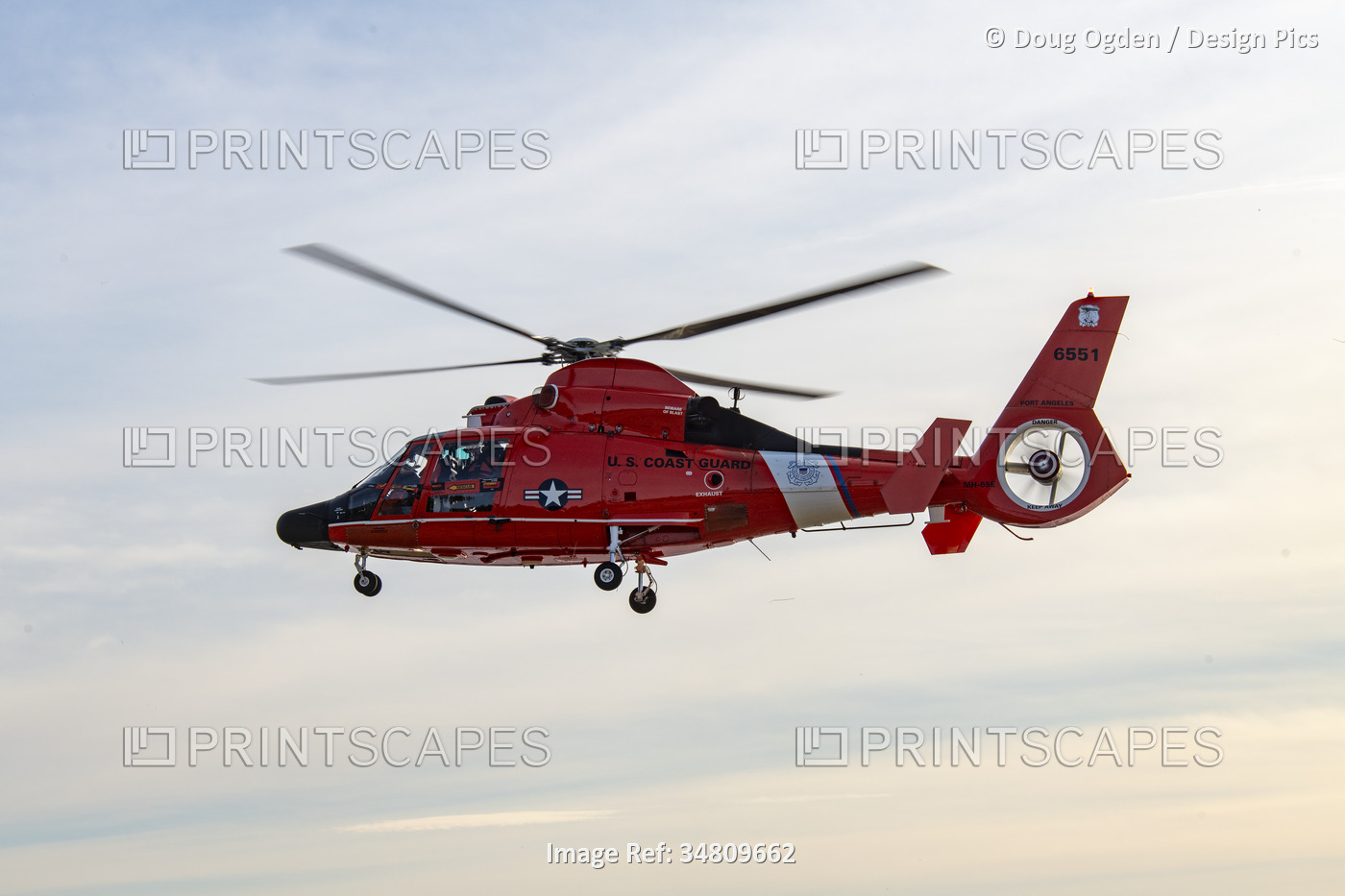 U. S. Coast Guard crew and Eurocopter MH-65 performing rescue training ...